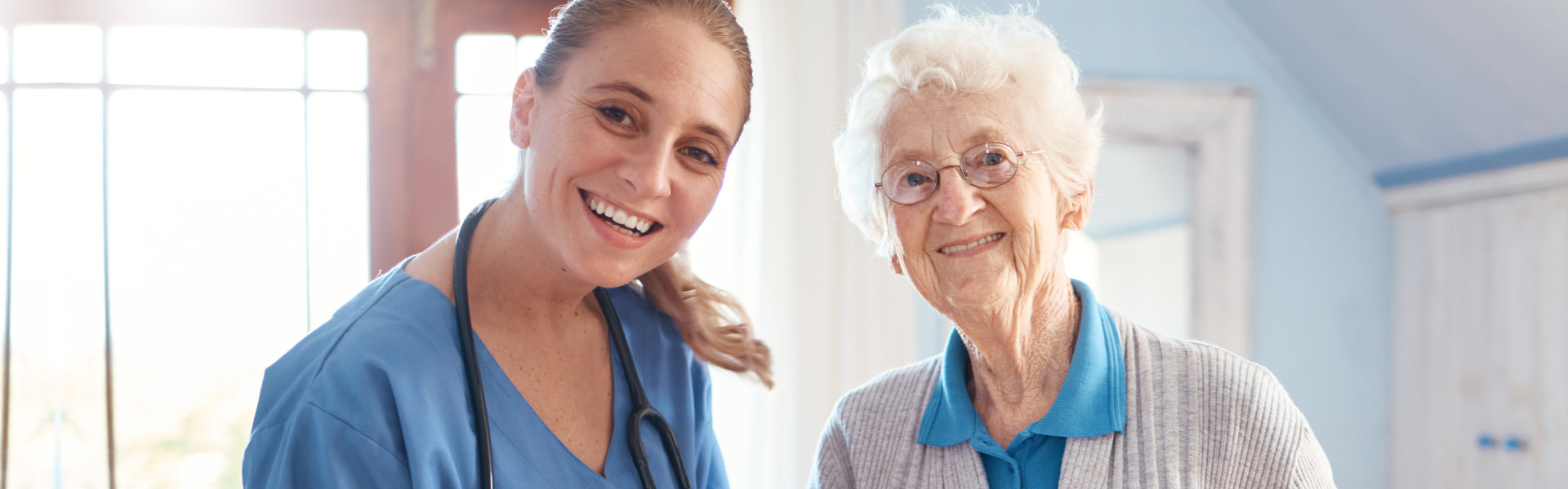 nurse and senior smiling