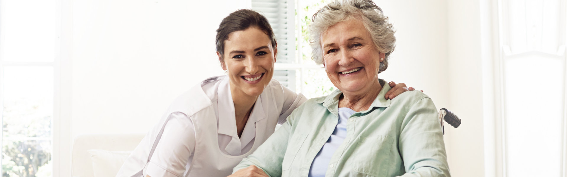 nurse and senior smiling